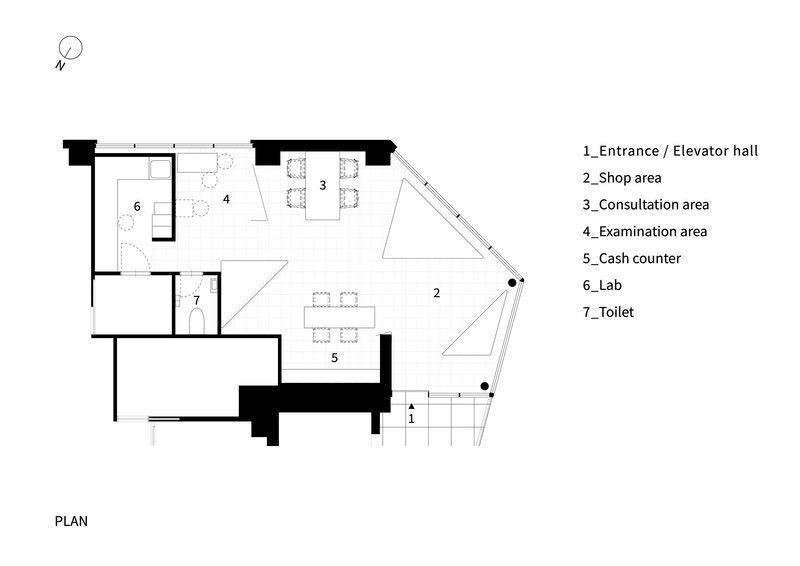 Floor plan drawing showing examination area, consultation zones, lab, and angled glazed facade