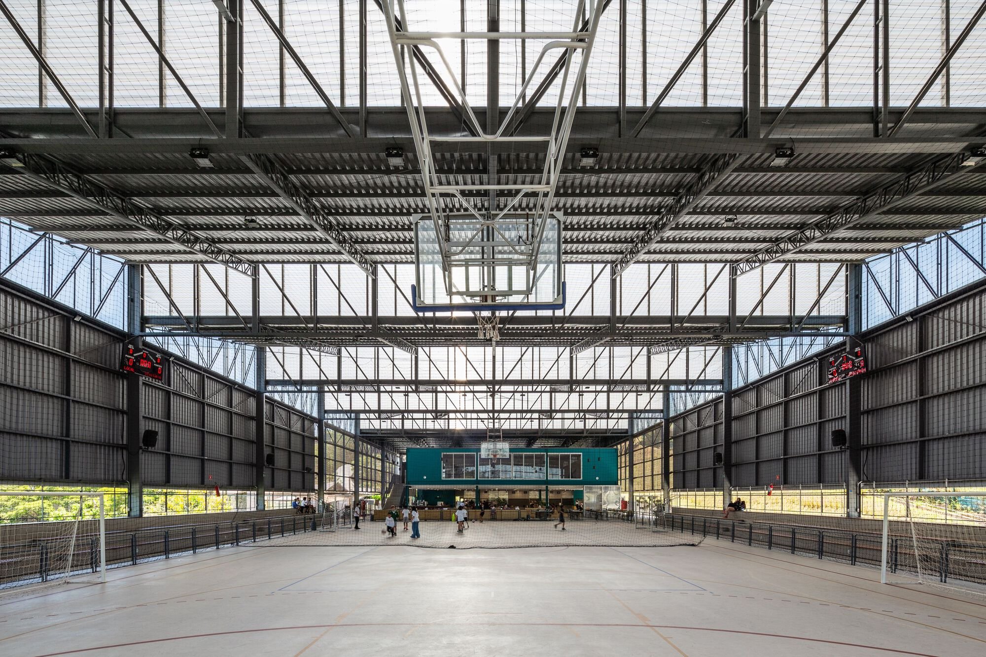 Estúdio Trópico Shelters a School Arena Under 2,100 Square Meters of Sawtooth Roof in São Paulo
