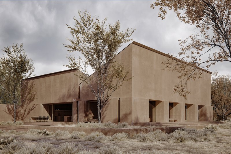 Stepped volumes with rammed earth walls and square openings among deciduous trees in autumn