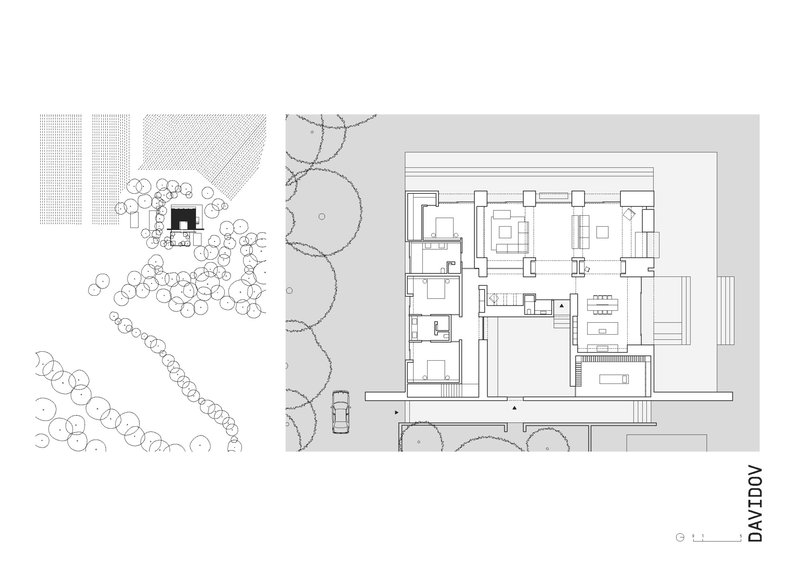 Floor plan drawing showing two-level layout with courtyards and surrounding landscape vegetation