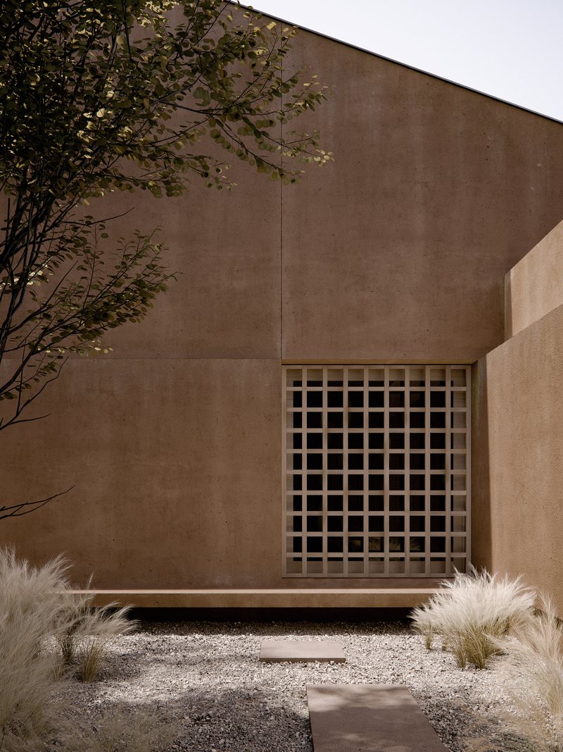 Gridded timber screen window set into a rammed earth facade beside a tree and gravel courtyard
