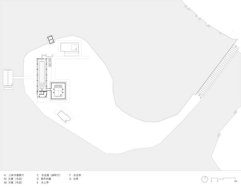 Site plan drawing showing clustered building volumes along a curving boundary with a long access road
