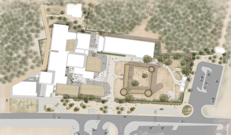 Site plan drawing showing clustered volumes among tree patterns and pathways in arid terrain