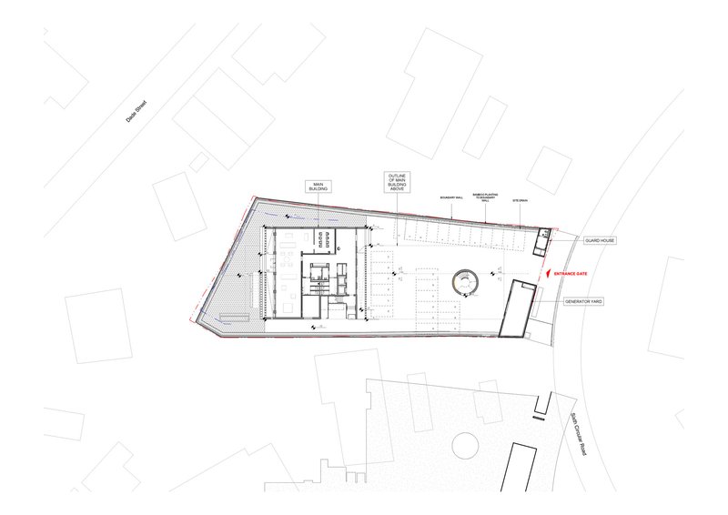 Ground floor plan drawing showing workspace areas and a circular feature within an angled site
