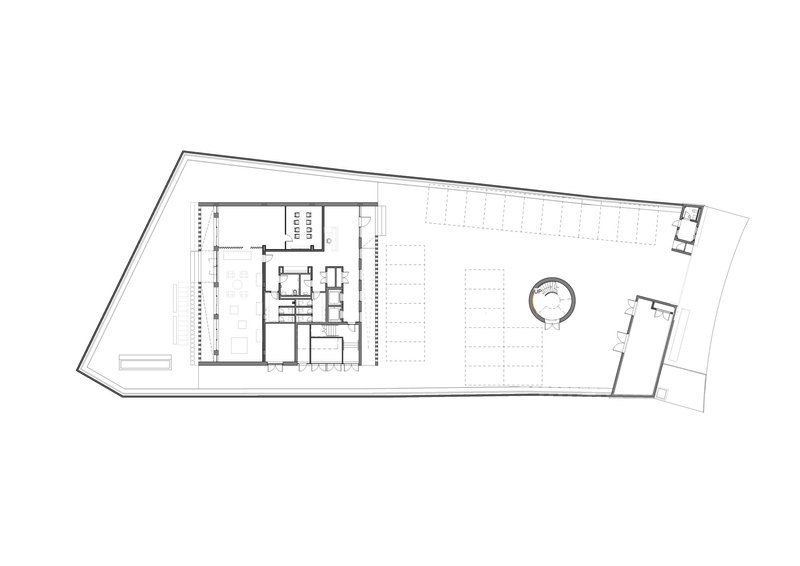 Floor plan drawing showing the full trapezoidal layout with rooms and courtyard zones
