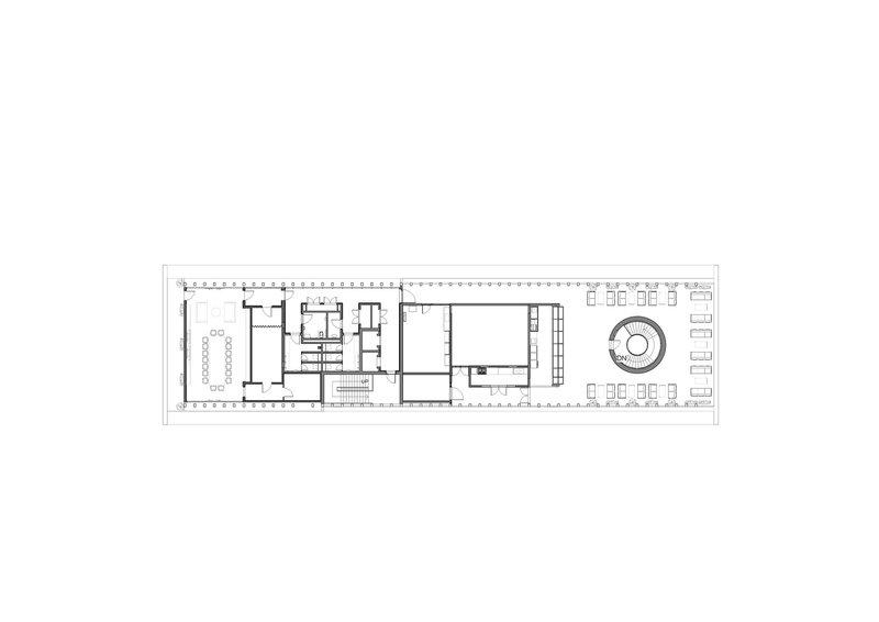 Floor plan drawing revealing central circulation core with surrounding rooms and outdoor seating areas