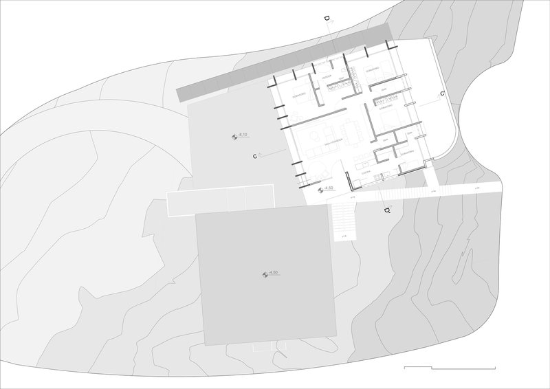 Site plan drawing showing rectangular volumes and terraced courtyards set into hillside topography