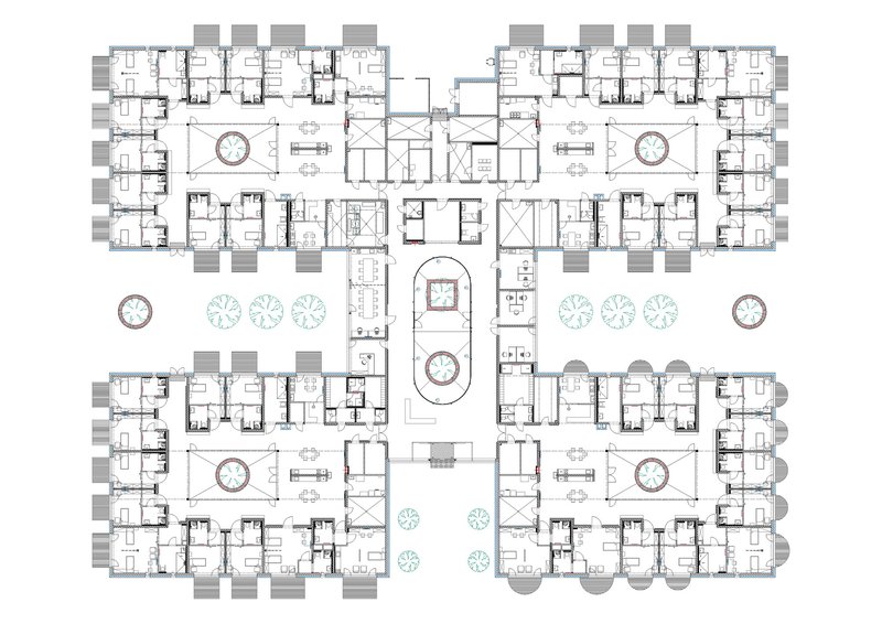Floor plan drawing showing four residential wings arranged symmetrically around central courtyards and circulation spaces