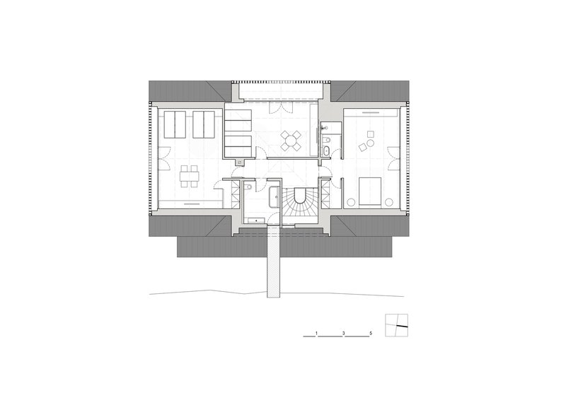 Upper floor plan drawing showing living and sleeping areas with central staircase and projecting balconies
