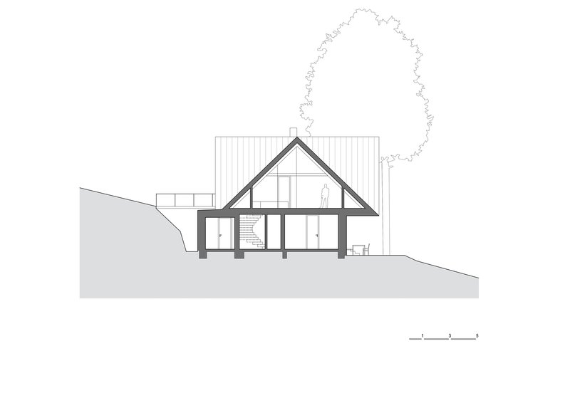 Section drawing revealing the pitched roof profile with interior spaces and a tree outline to the right