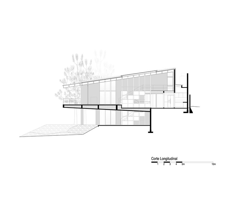 Longitudinal section drawing revealing a two-level structure with sloped roof and adjacent trees