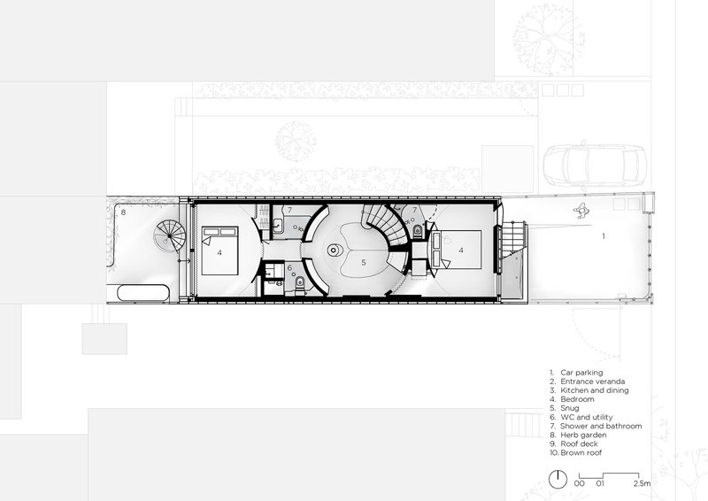 Floor plan drawing of a narrow residence with a central oval staircase and labeled rooms