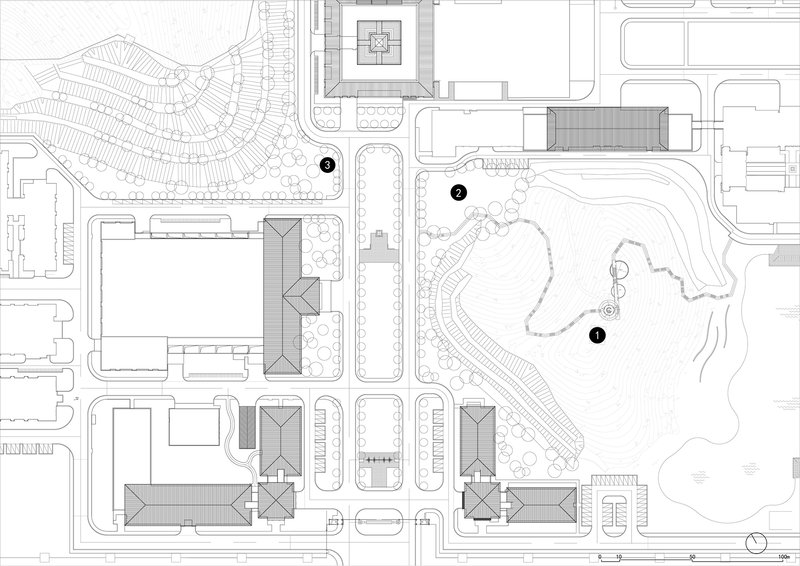 Site plan drawing showing campus buildings, pathways, and a landscaped park with circulation routes