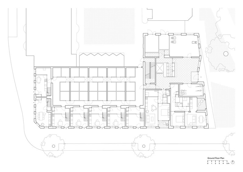 Ground floor plan drawing displaying a row of townhouse units with individual entries and street trees