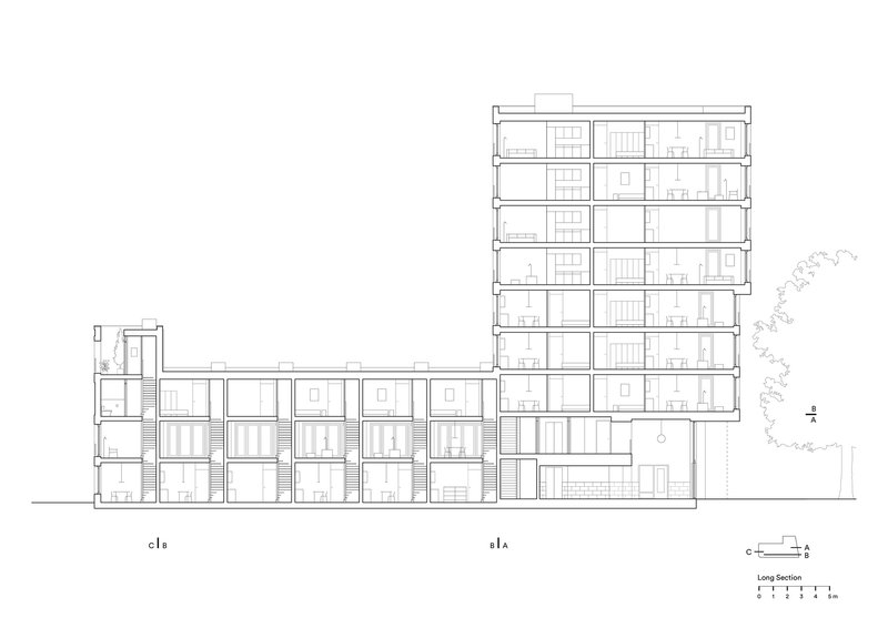 Long section drawing showing a multi-story residential block with stair cores and unit divisions