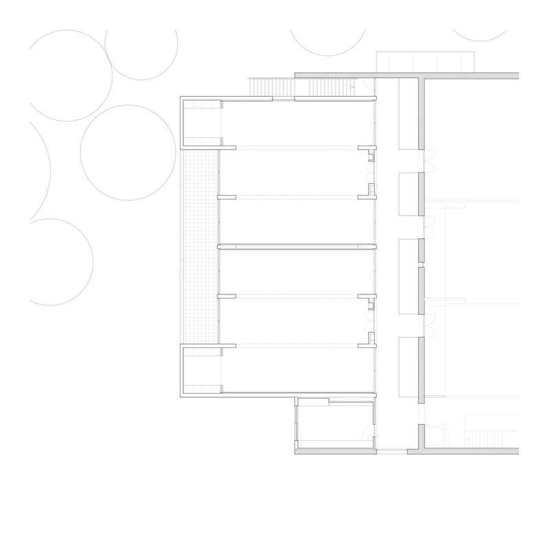 Upper floor plan drawing showing interior divisions with a gridded courtyard and surrounding trees