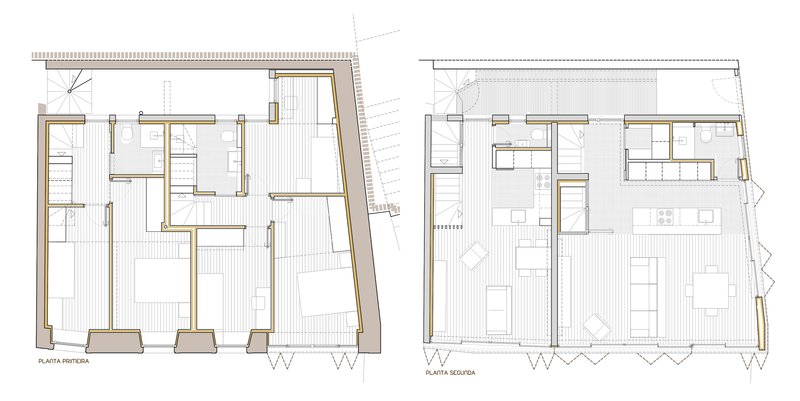 Floor plan drawings showing two levels with irregular perimeter walls and interior room divisions