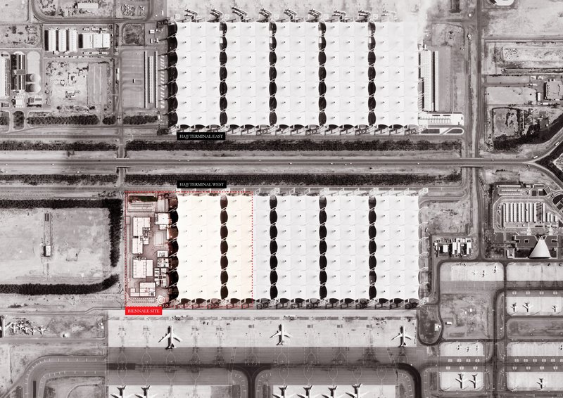 Aerial view showing two parallel courtyard buildings separated by a roadway and pedestrian plaza