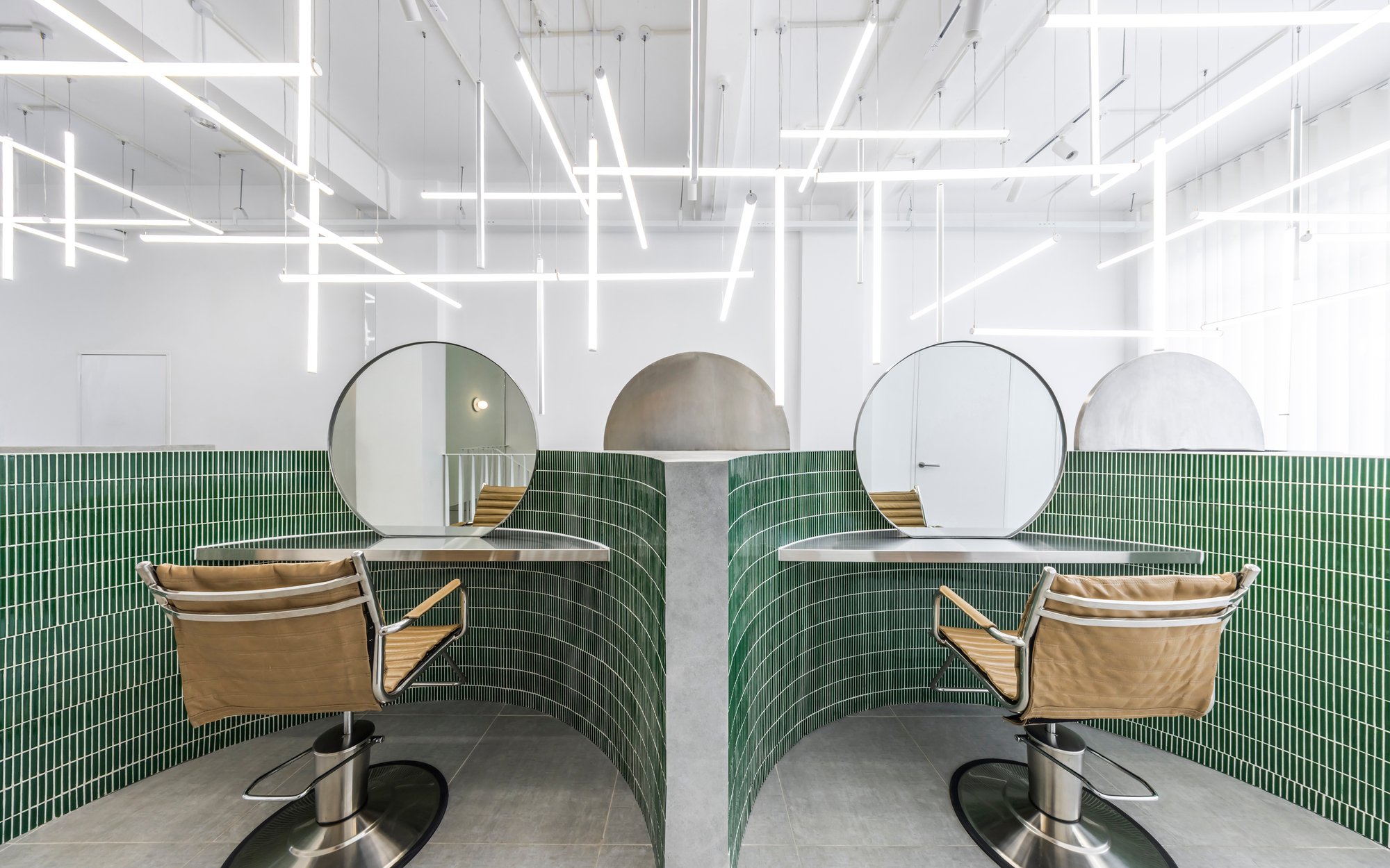 Inrestudio Folds a Single Sculptural Wall Through a Ho Chi Minh City Hair Salon