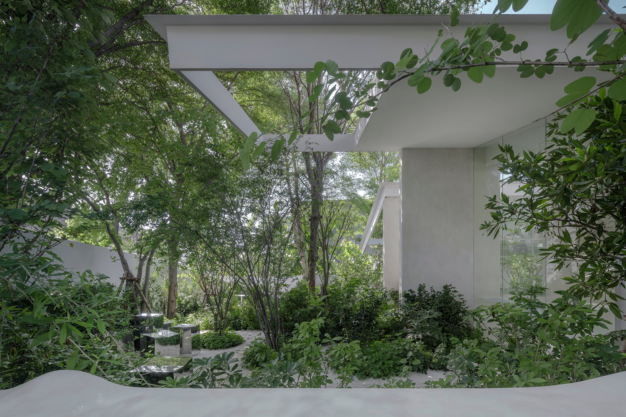 IDIN Architects Grows a Coffee Shop Out of the Jungle Beside Bangkok's Busiest Motorway