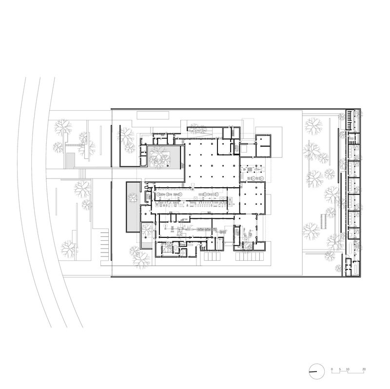 Ground floor plan drawing showing the arrangement of rooms around a large central hall with grid columns