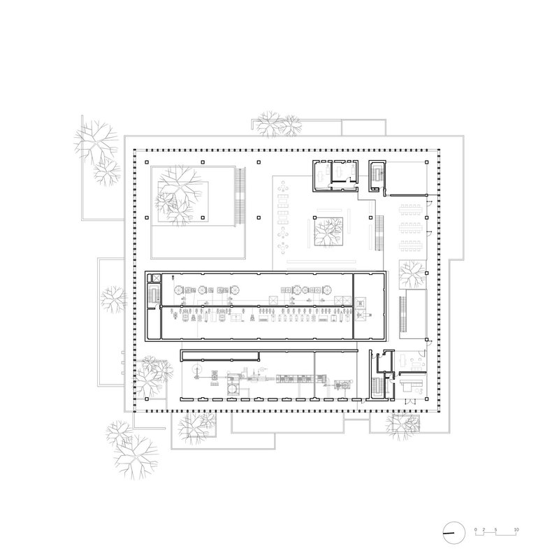 Floor plan drawing showing the same layout with columns and service rooms arranged around internal courtyards