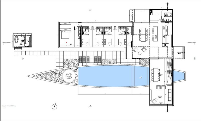 Floor plan drawing depicting bedrooms along a linear wing and a central swimming pool with adjacent living spaces