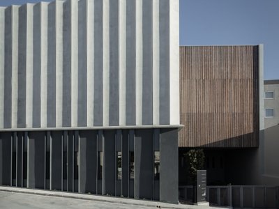 Chris Briffa Architects Wraps a Maltese Furniture Factory in a Curtain of Precast Concrete