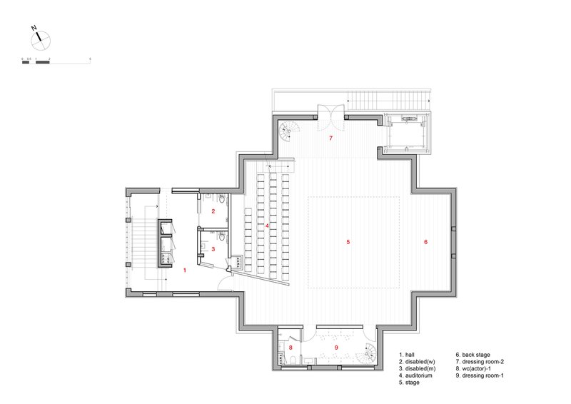 Floor plan showing an auditorium with seating rows and adjacent accessible facilities with circulation stair