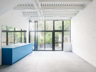 miogui Converts a Montreuil Commercial Unit into a Layered Glass-and-Steel Loft