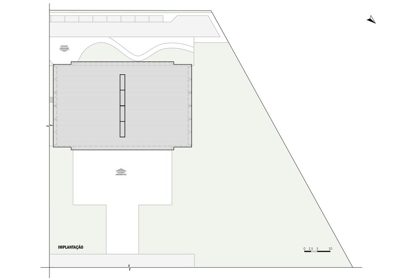 Site plan showing the hangar building with curved roof and surrounding apron area