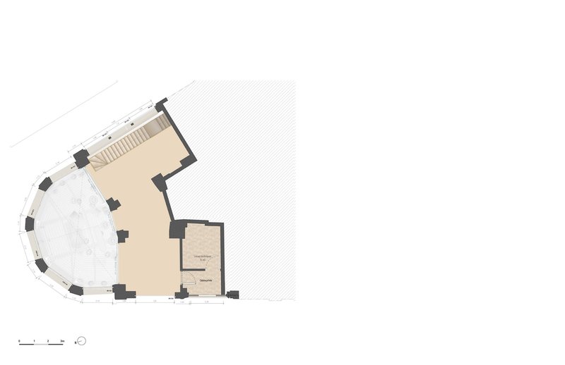 Floor plan drawing showing a curved corner volume with a stair and adjacent rectangular rooms
