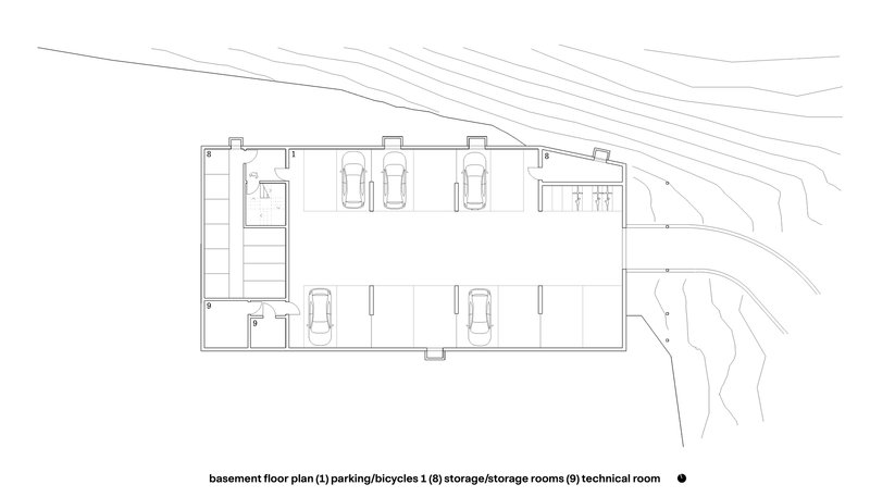 Basement floor plan drawing showing parking bays and storage rooms with topographic contours