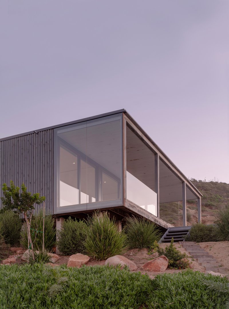 Stanaćev Granados Perches a Timber and Glass House on a Chilean Coastal Hillside for Visiting Grandparents