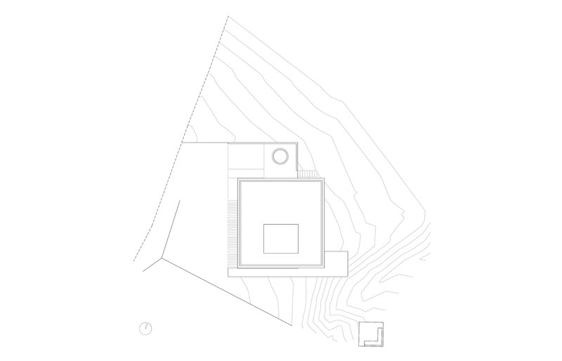Site plan drawing showing the rectilinear building volume set within sloping topographic contour lines