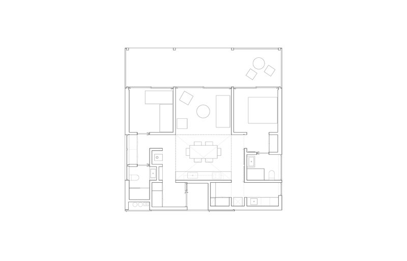 Floor plan drawing showing central living space with dining area flanked by two bedrooms and bathrooms
