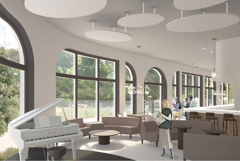 Bright performance lounge with arched glazing, soft seating, and a piano anchoring the cafe’s cultural identity.