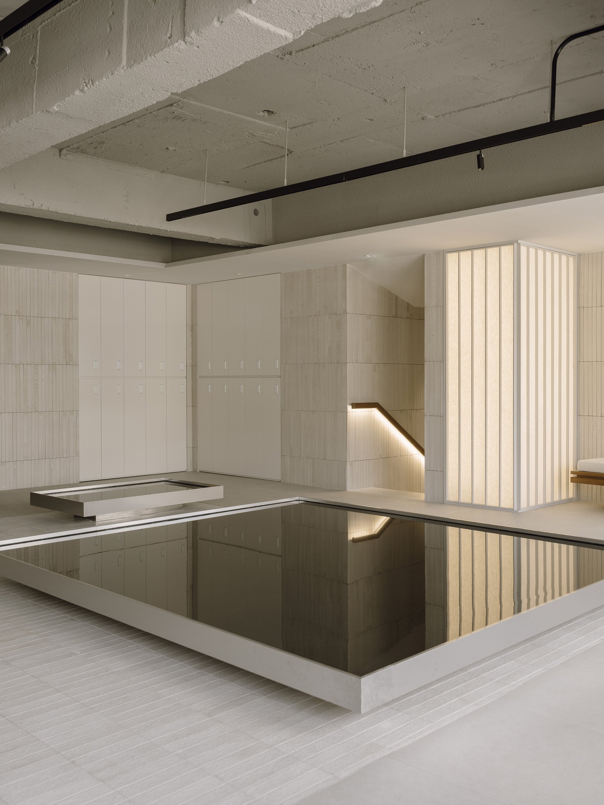 TYPE S Floods a Seoul Hair Salon with Reflective Pools and Ribbed Tile Volumes