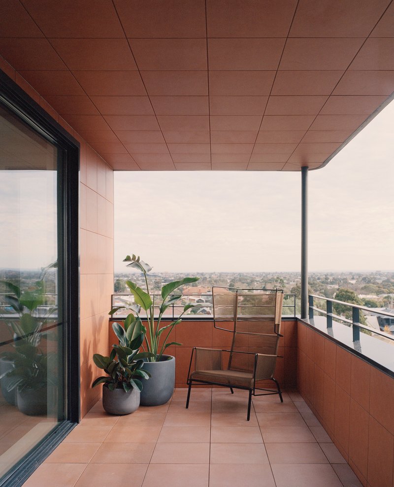 Private terrace with tile floor, timber ceiling soffit and city views in haze