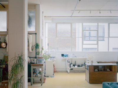 Studio Mutt Converts a Hackney Wick Industrial Unit into a Live-Work Space Shaped by Curtains and Resin