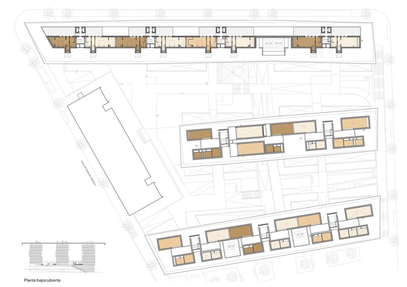 Ground and lower level floor plan drawing showing the angled building footprints on sloped terrain