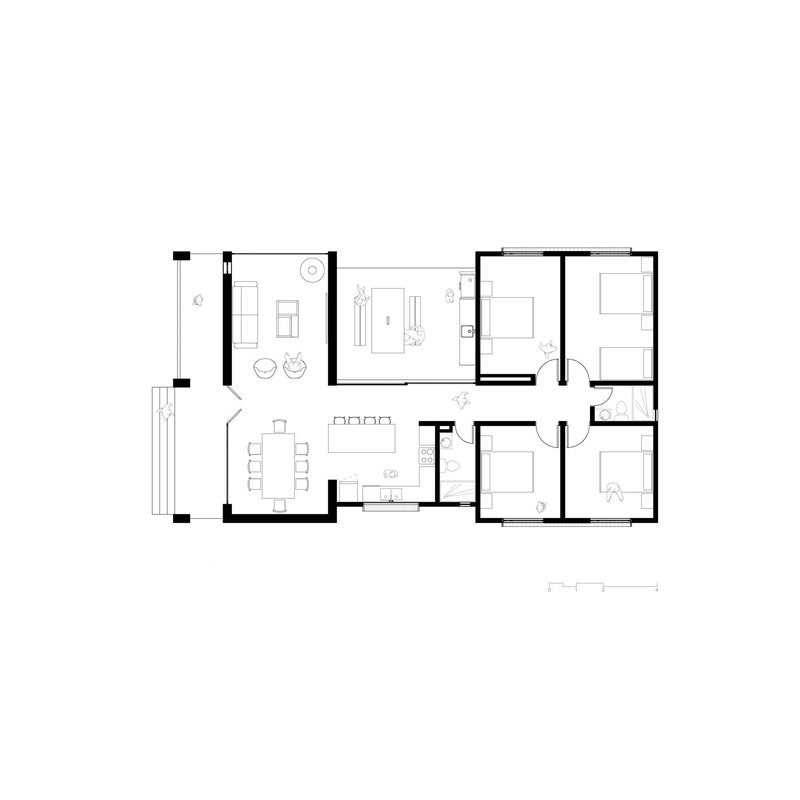 Floor plan drawing showing open living and dining areas with three bedrooms and bathrooms