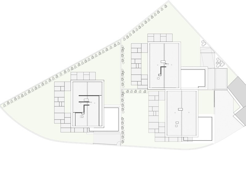 Floor plan drawing showing upper level layouts with bedrooms and staircases in two buildings