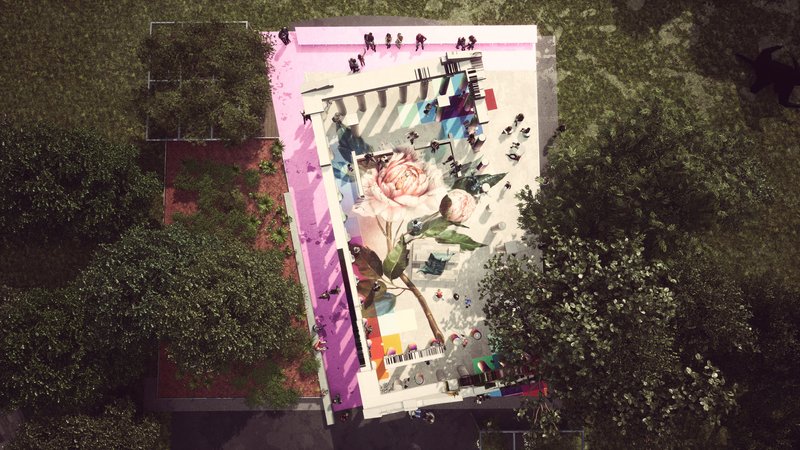 Aerial view of the painted plaza floor showing a large floral mural surrounded by dense tree canopy