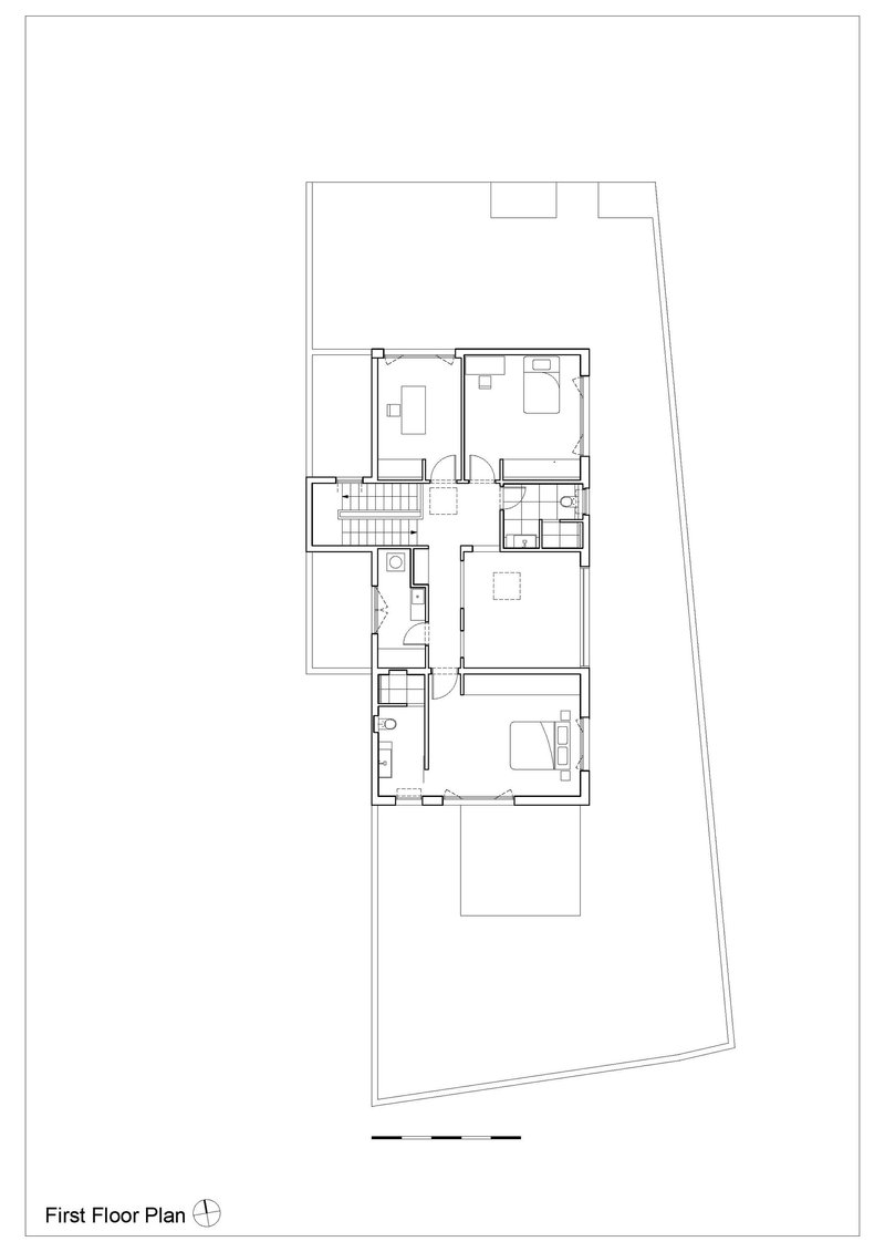 First floor plan drawing showing a residence with bedrooms, staircase and terrace on an angled lot