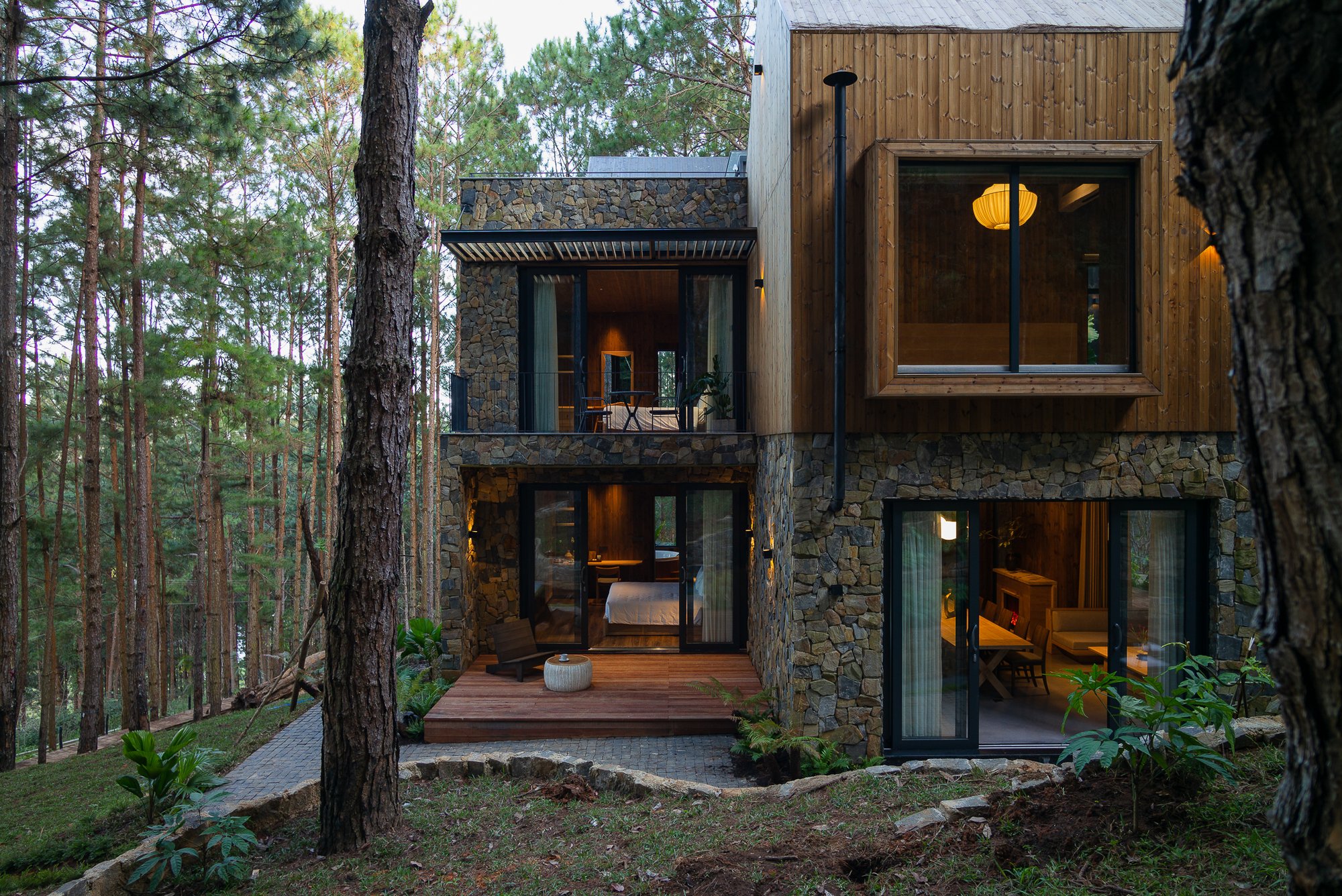 APS Concept Wraps a Dalat Forest Villa in Pine Wood and Stone to Blur the Line Between Shelter and Canopy