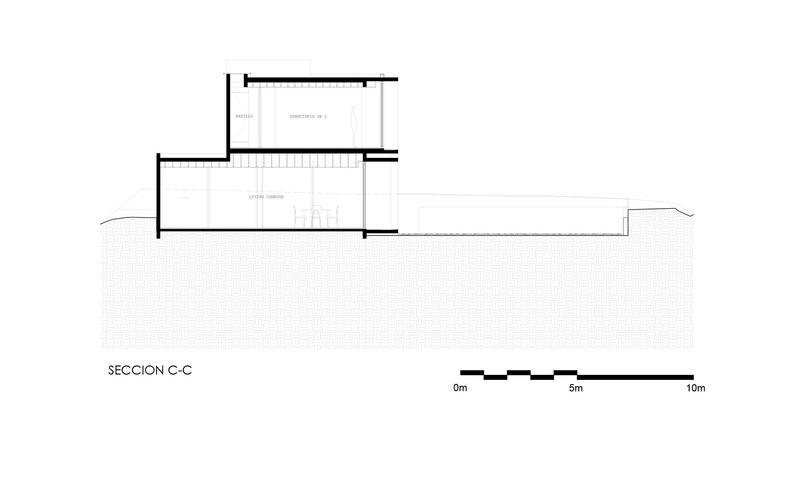 Section drawing showing double-height living space with mezzanine and sloped ground plane
