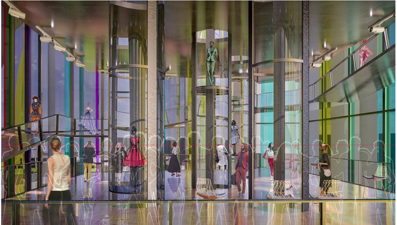 Interior view of the vertical fashion show tower, where glass tubes, ramps, and displays create an immersive fashion experience.