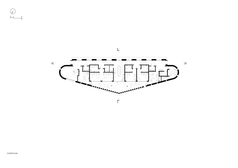 Floor plan drawing of the elongated curved layout with rooms along both edges