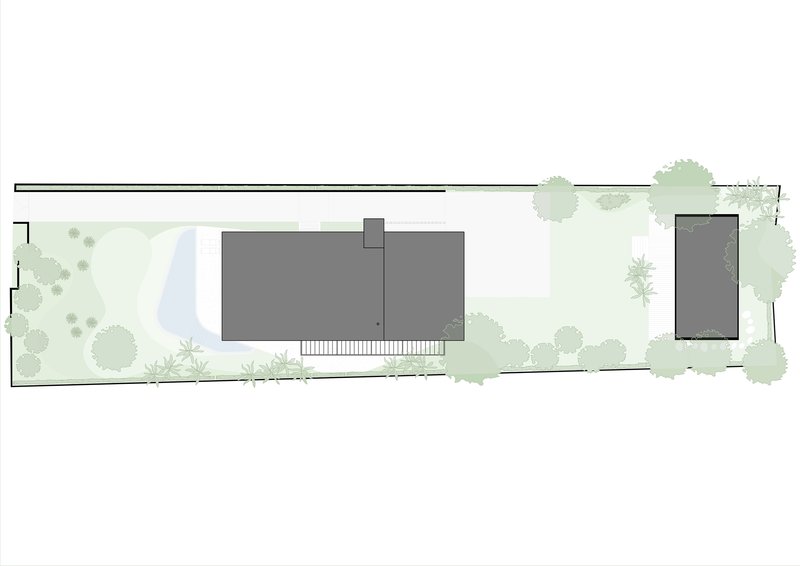 Site plan illustrating building footprint in dark gray with pool, lawn, and perimeter vegetation